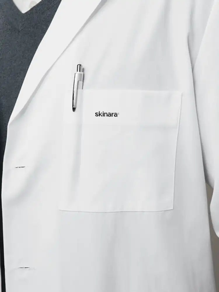 White lab coat with 'skinara' branding on the pocket