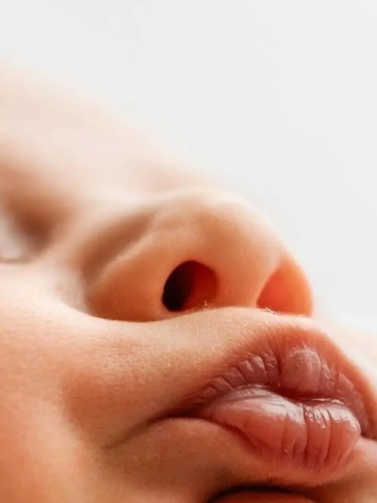 Close-up of a baby's face with a blurred background