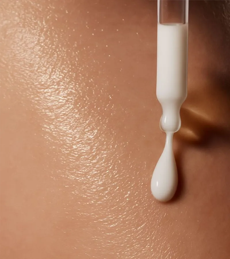 skinara custom serum being applied to the skin using the dropper