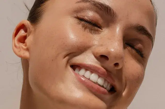 Best face sunscreen showing smiling womans face in the sun