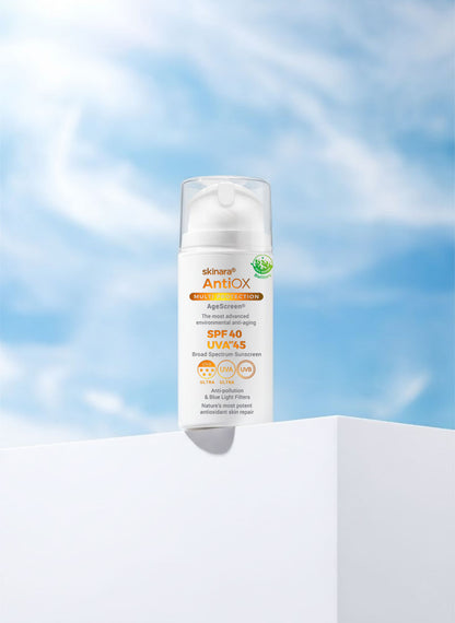 AgeScreen sunscreen large size bottle on a white cube with sky behind