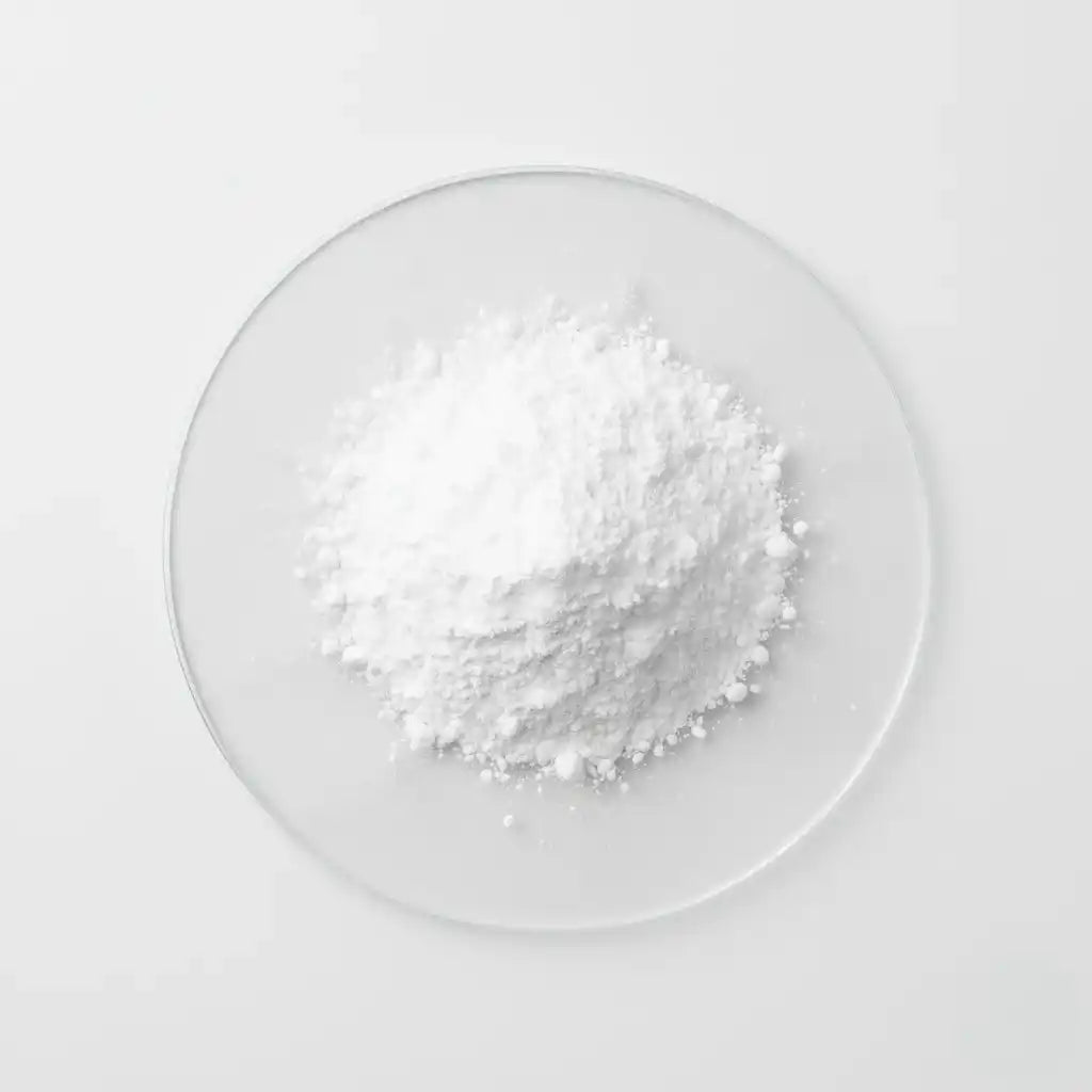 White niacinamide powder on a clear glass plate against a white background