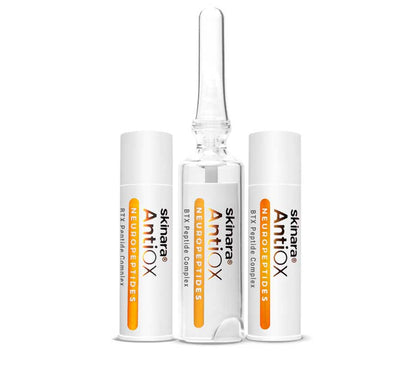 Three BTX Serum ampoules with cap on against a white background