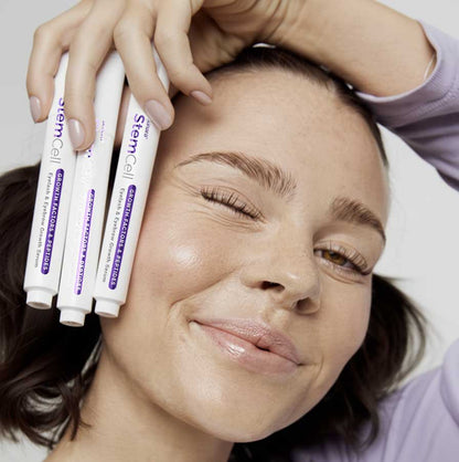 Woman holding 'growth factors' eyelash and brow gel serum multi pack discount deal