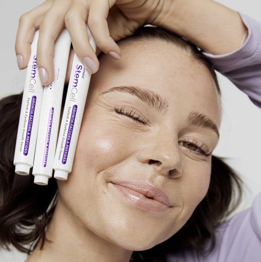 Woman holding 'growth factors' eyelash and brow gel serum multi pack discount deal