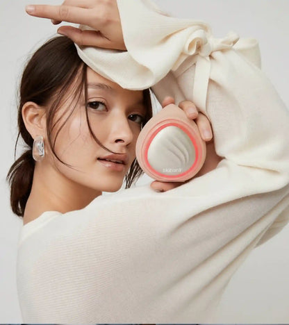 woman holding skinara LED light therapy device