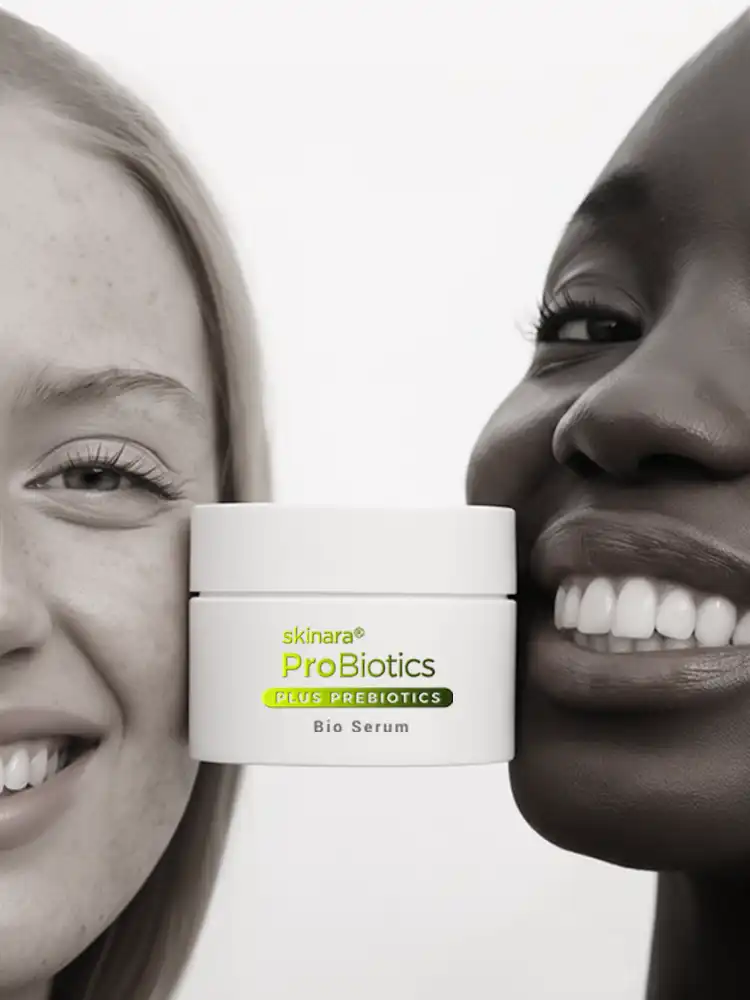 two girls with skinara bio serum jar held between their faces