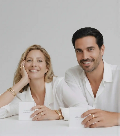 Man and woman holding hair growth and scalp treatment serums designed to reduce hair loss and promote thicker hair